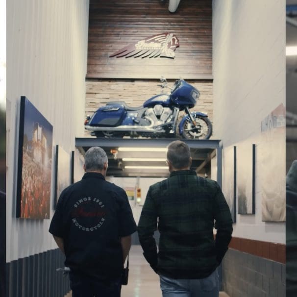 A picture of Artie Starrs (Harley-Davidson's new CEO) set against the backdrop of a hallways in Indian Motorcycles' factory, with new CEO Mike Kennedy placed at the right. Media sourced from Wuhan Talks and Indian Motorcycles.