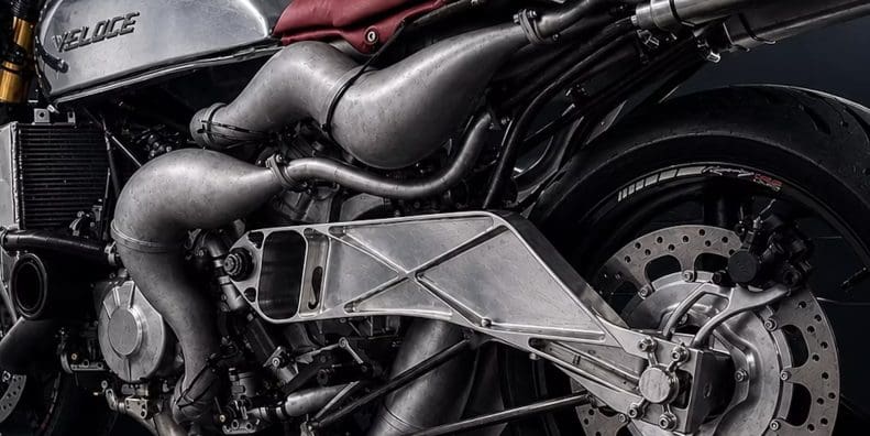 A dynamic side view of the Veloce Apron - a super bike with an insane X formation engine platform.