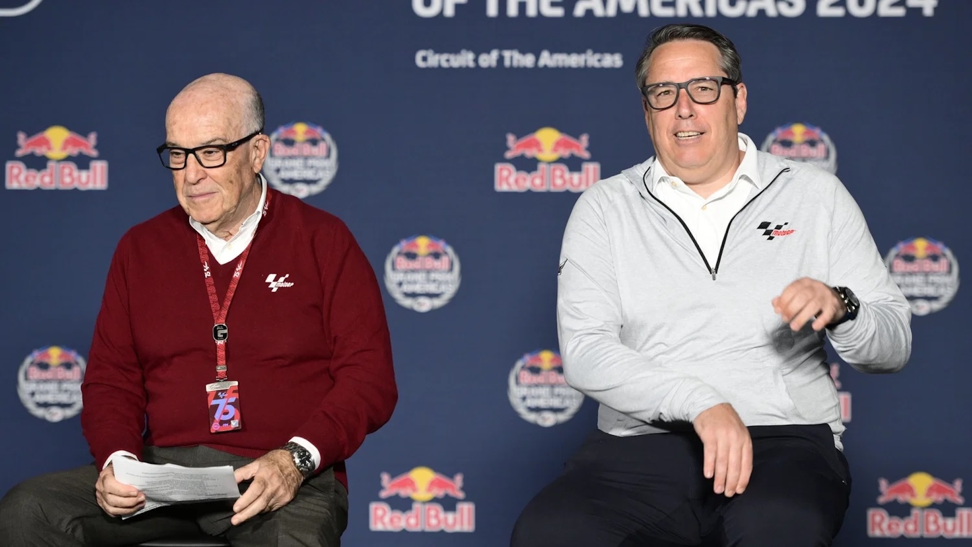 A view of Carmelo Ezpeleta and other members of Dorna Sports - now MotoGP Sports Entertainment Group - and Liberty Media Group. Media sourced from Crash.